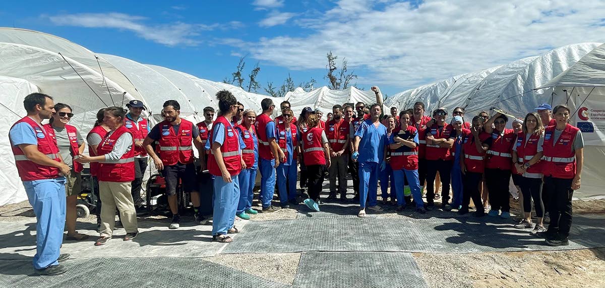 Members of the Spanish medical team posing in front of the field hospital.