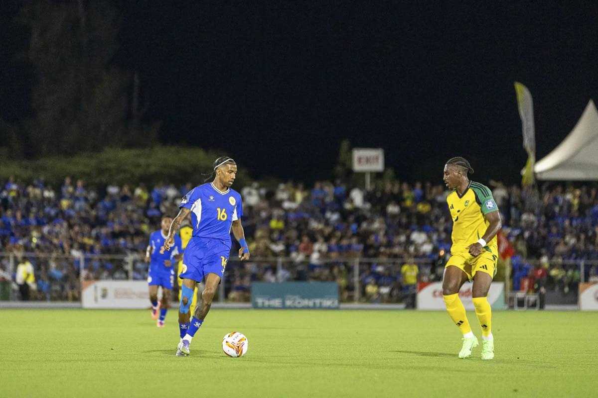 Courtesy of concacaf.com 
Jearl Margaritha (left) of Curacao is confronted by Jamaica’s Amari’i Bell during a Concacaf World Cup Qualifying football match in Curacao. Curacao won 2-0 with goals from Livano Comenencia and Kenji Gorre.  