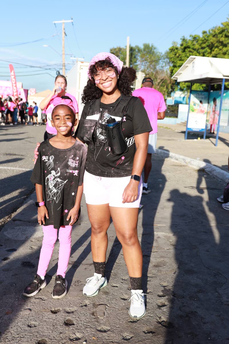 Dusted in pink powder and bright smiles are mother-daughter duo Samantha Delgado and little Kehlani Perkins.