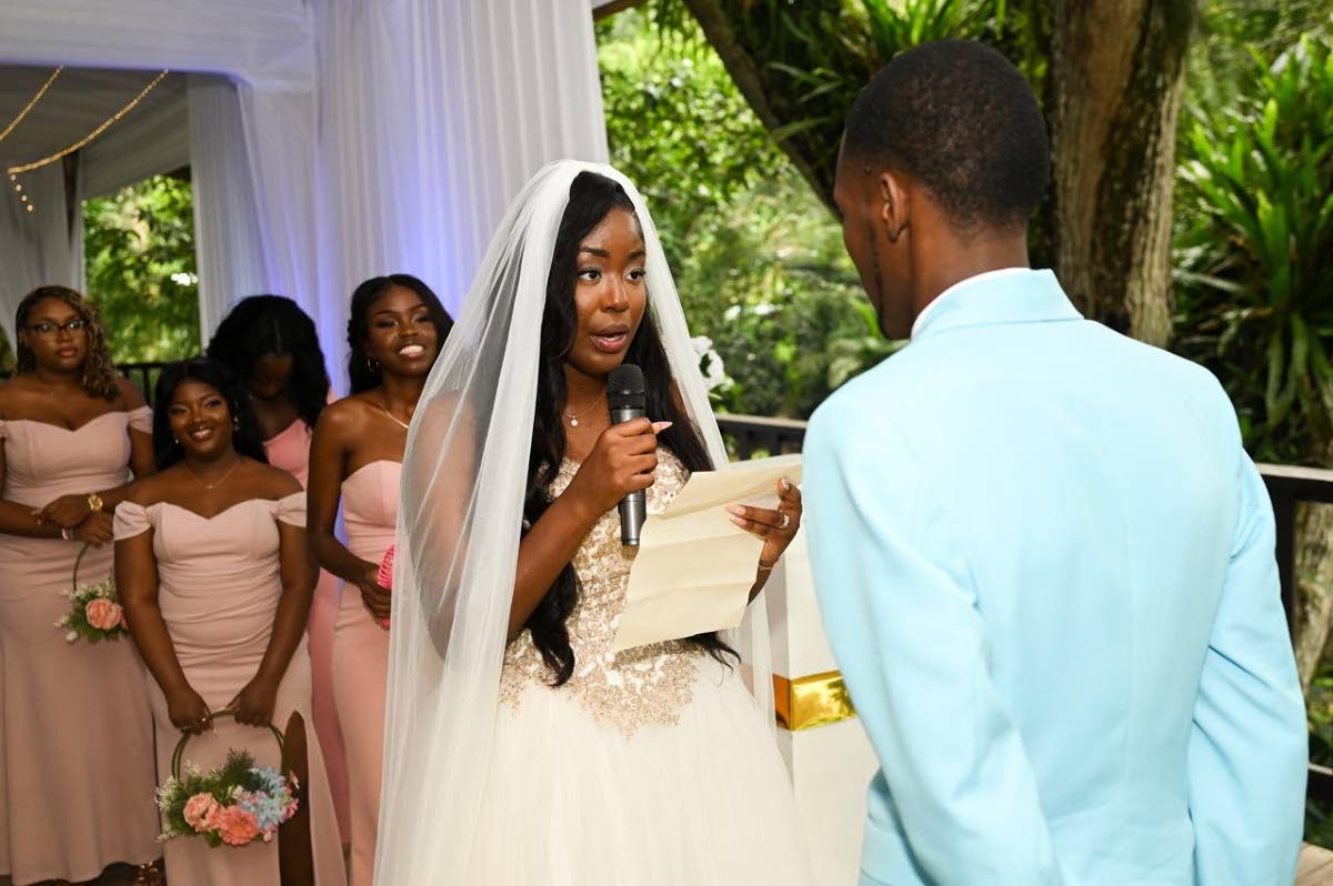 Surrounded by loved ones,  Abbiegale reads her vows to the love of her life, Dane.