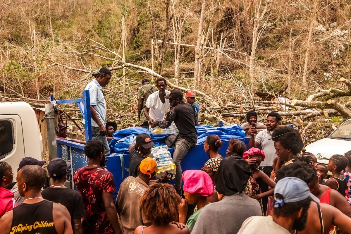 Pencils4Kids and the Maroons joined hands in distributing relief supplies in Quickstep, St Elizabeth.