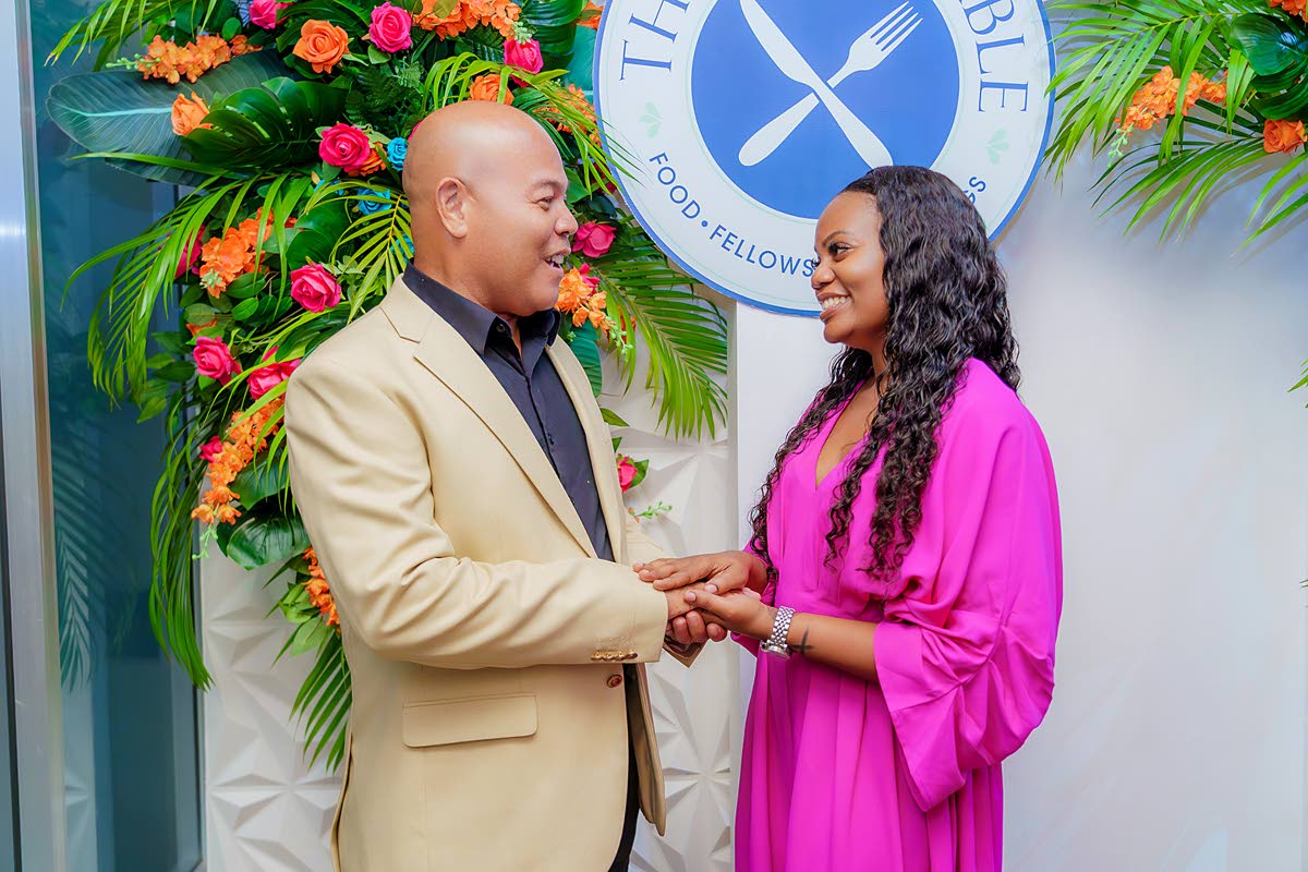 Bishop Shankie Chin congratulates Keneisha Green on the opening of The Bless Table.