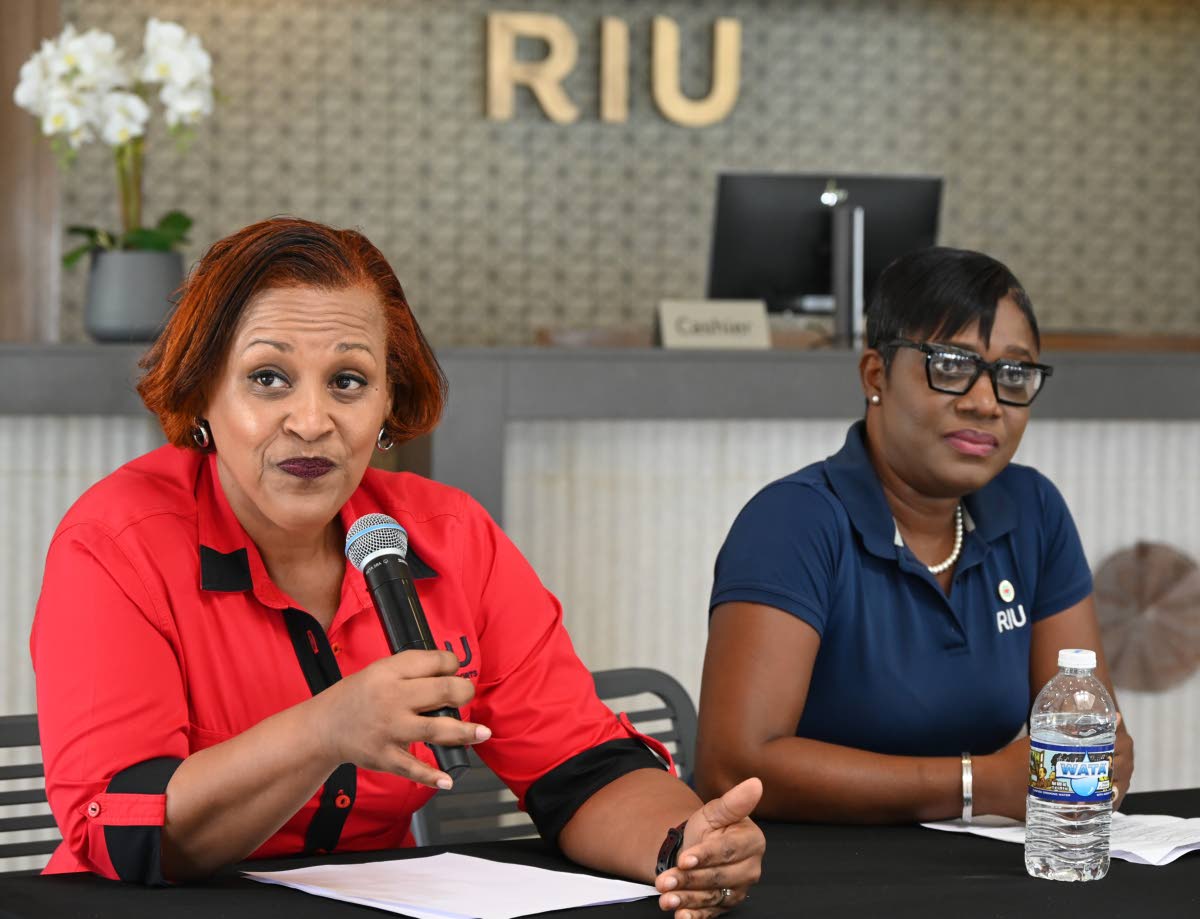 Niurka Garcia-Linton (left), director of sales at RIU Resorts – Jamaica, addresses the media during a press briefing at RIU Montego Bay on Wednesday, as Somae Pitkin-Shakes, human resource manager, RIU Montego Bay, looks on.