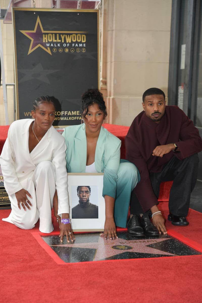 Taylor Simone-Boseman (centre), widow of the late actor, is flanked by Letitia Wright and Michael B. Jordan. 