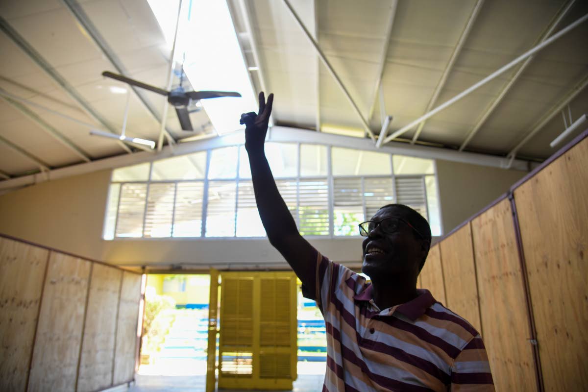 Milbert Miller, principal of the Sydney Pagan STEM Academy in St Elizabeth, shows damage done to some of the school’s facilities by Hurricane Melissa.