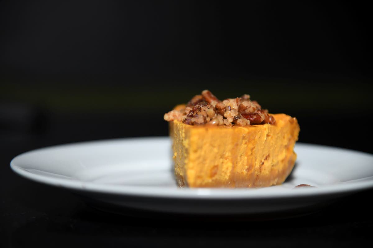 Here is a closer look at the island-spiced pumpkin cheesecake topped with roasted pecans.