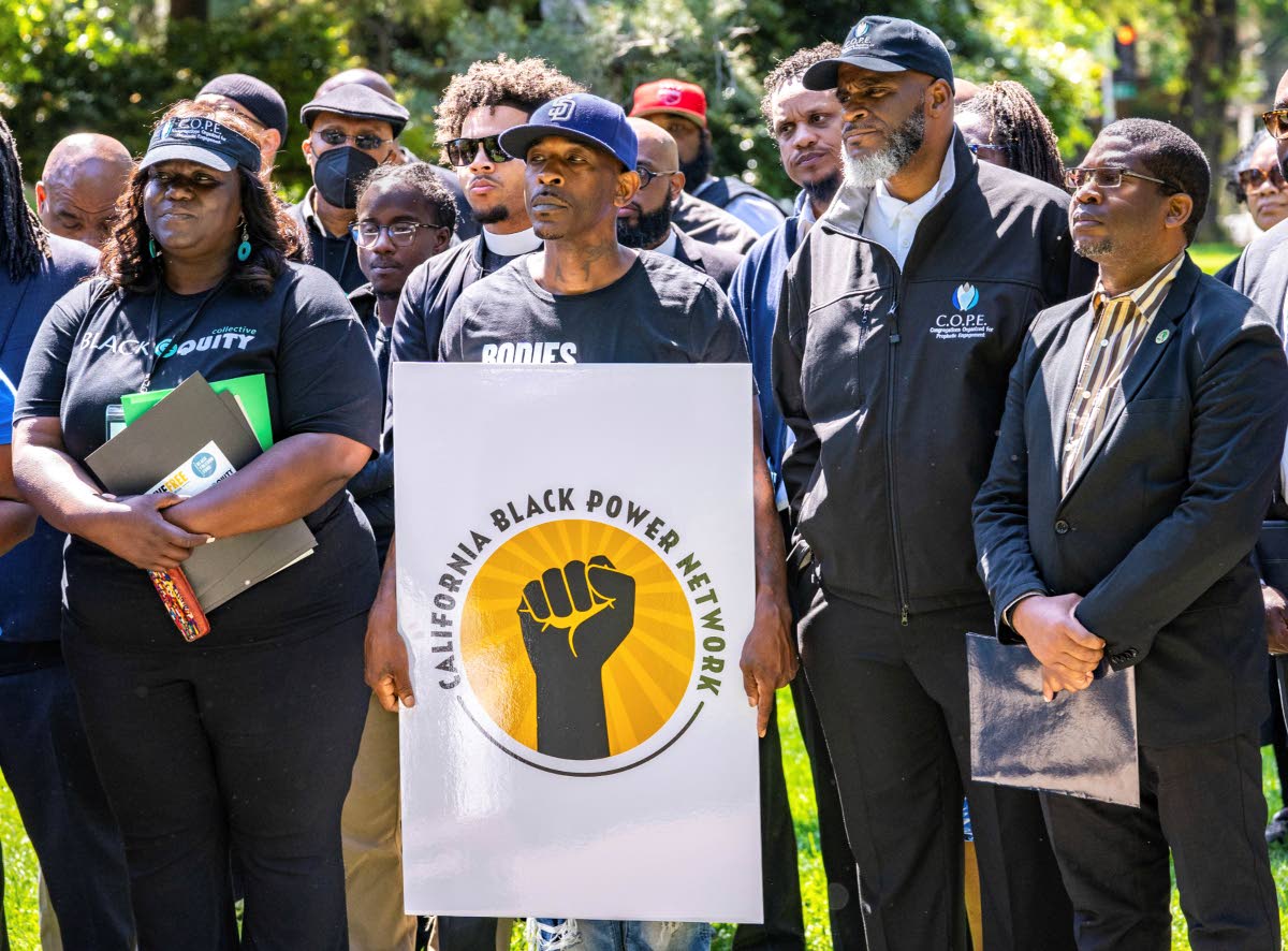 Supporters listen as speakers share their views on reparations and other issues during the Black Power Network news conference at the state Capitol in 2023. 