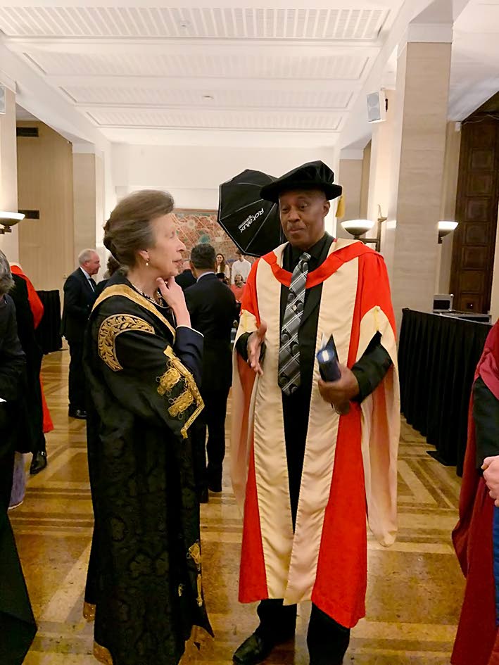 University of London Chancellor Princess Anne (left) speaks with Professor Sir Hilary Beckles during the conferment ceremony on November 19 in the United Kingdom.
