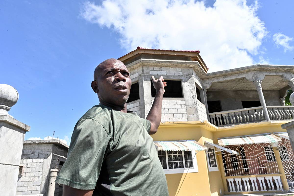 Wayne Wheatley, displaced by Storm Gustav, stands proudly outside his home in West Albion, St Thomas.