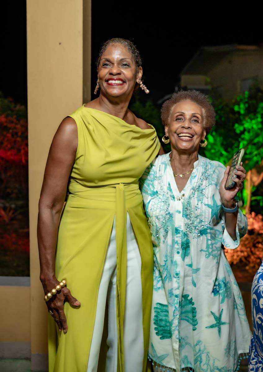 It’s all smiles and cheers as Ingrid Thame (left) and Annie Rose Kitchin enjoy the festivities.