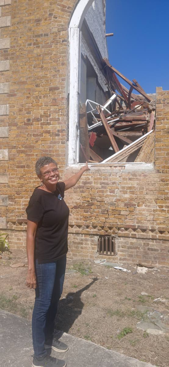 Allison Morris pointing to the platform where she used to play the pipe organ at St John’s Anglican Church in Black River, St Elizabeth.