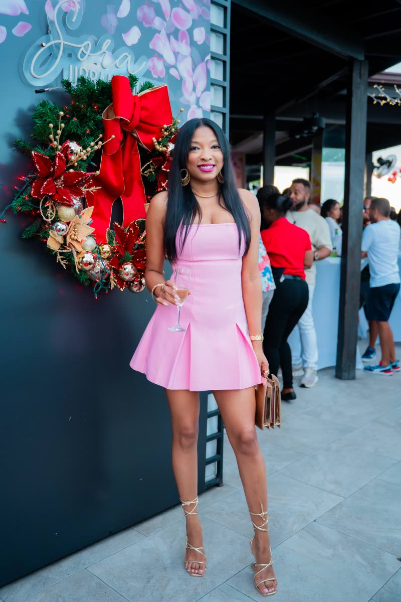 Realtor Kellie-Ann Brown rocks a pink mini for the occasion.
