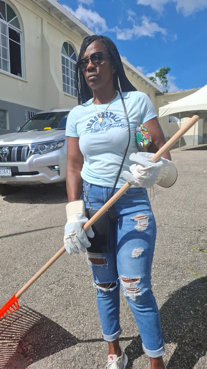 Marlene Greniane, one of the appointed workers, says she is grateful to be able to help remove debris while reflecting on the impact of the hurricane in her community.