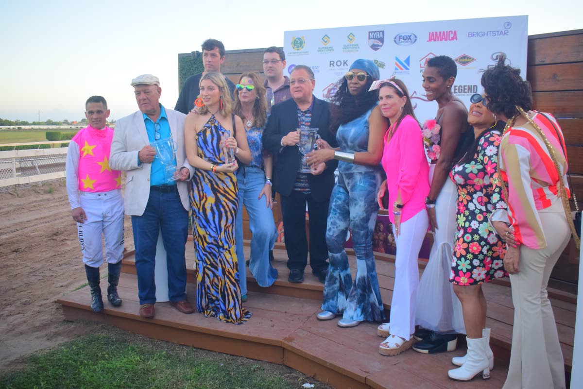 
The consortium of women who own RIDEALLDAY share the spotlight with the Mouttet Mile trophy it won at the first time of the asking at Caymanas Park yesterday.