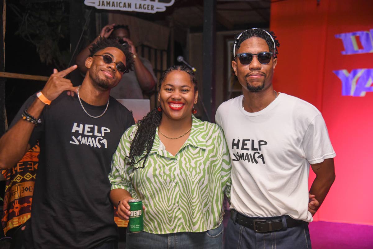Friday Night Cru’s Djavan Warner (left) and Damani Gardner (right) flank Davida-Mae Chambers Bedassie, brand manager of Legend.