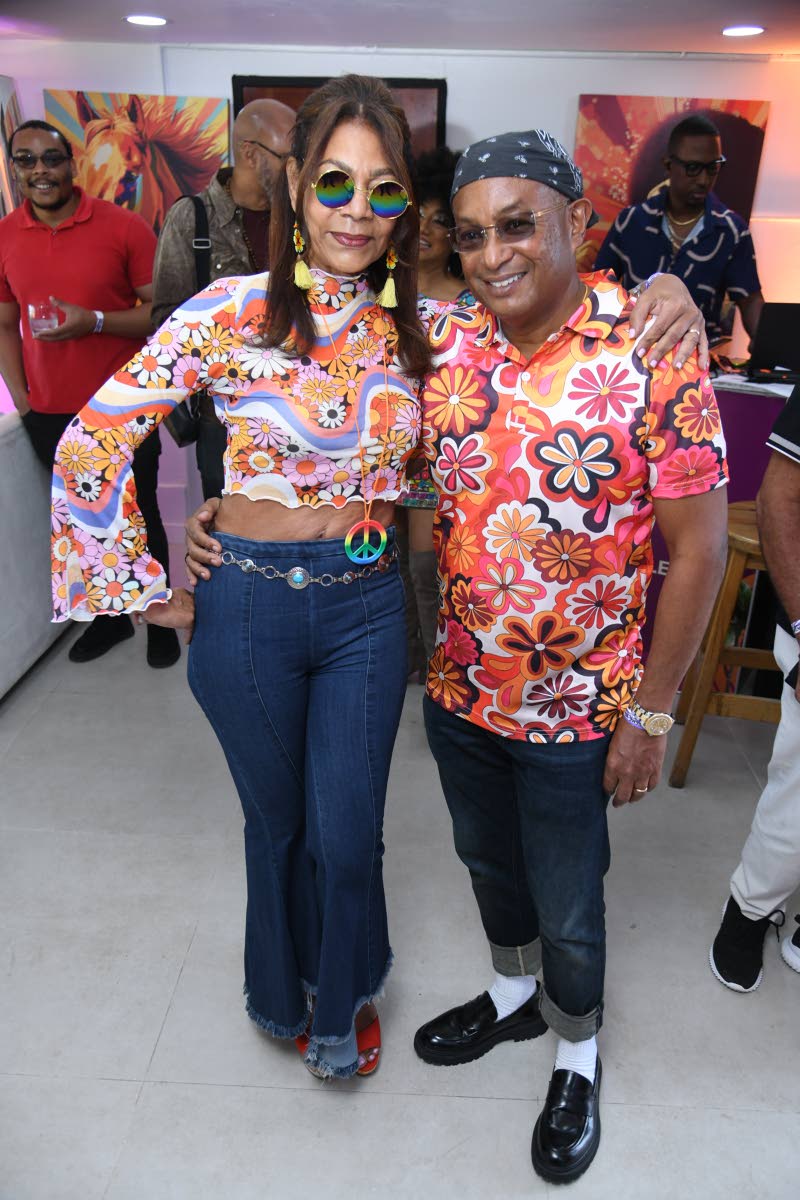 Konrad Mark Berry, executive vice-chairman of Mayberry Investments, shows up to the main event in a bold pattern alongside his lovely wife, Genny, who happily sourced their funky ‘fits for the occasion.