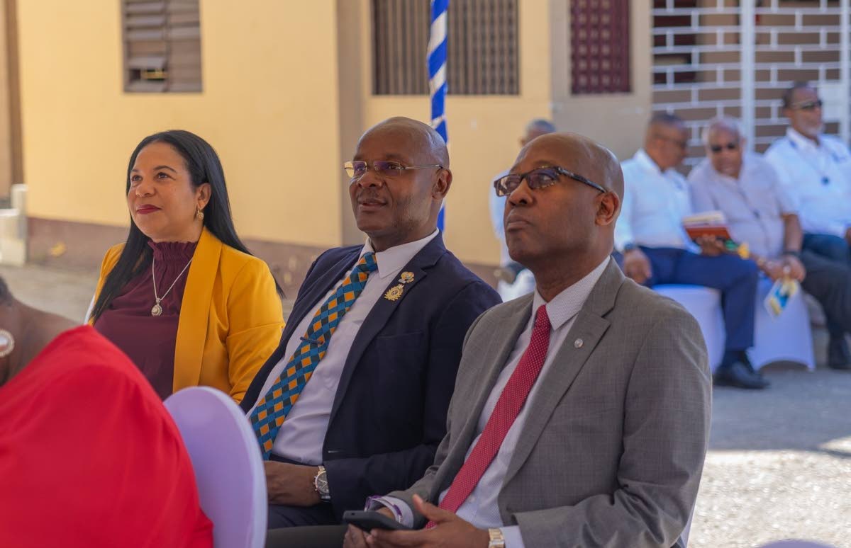 From left: Dr Laine Oakley Williams, senior general manager of the National Housing Trust; Lieutenant Governor Michael Powell; and Distinguished Lieutenant Governor Hugh Reid of the Kiwanis Club of North St Andrew, listening to presentations at the handove