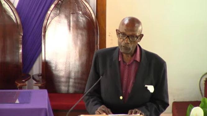 Engineer Roydell Williams giving the eulogy for his long-time friend, the late businessman Ruel Alphanso Crawford.