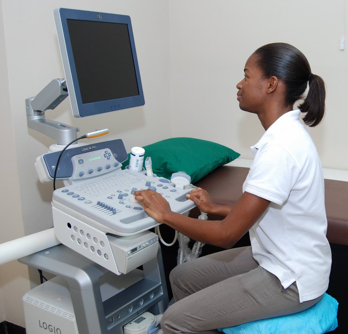 In this September 2013 photo, a technician operates a machine at Elite Diagnostics Limited in Kingston.