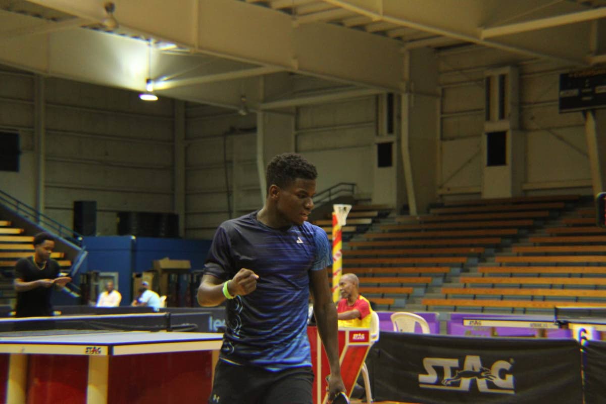 Joel Lamm pumps his fists in celebration of a point in the final of the National Table Tennis Championships against Roberto ‘Magic Dino’ Byles at the National Indoor Sports Centre in September.