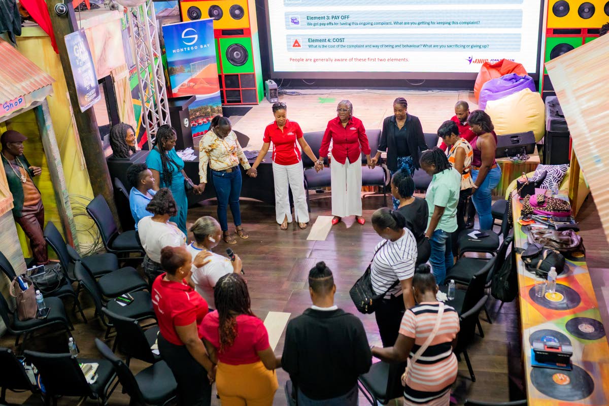 JMMB team members and parents at the recently organised CHAMP Parenting Conference in Montego Bay.