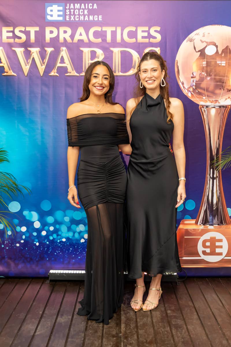 Stephanie Wehby (left), who collected the inaugural Jamaica Stock Exchange CEO Award on behalf of her late father, retired GK Group CEO, Don Wehby, is joined by Ali Matalon, founder and CEO of CorpCare.