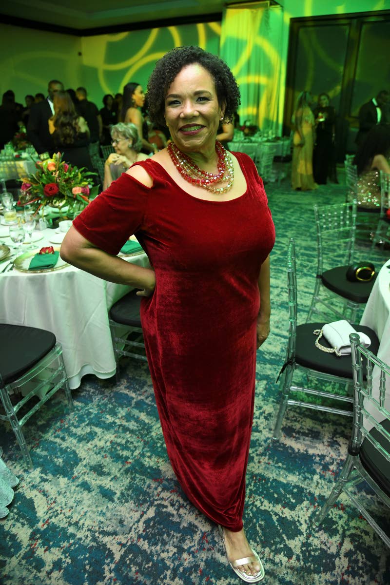 Corah Ann Robertson-Sylvester, president of the Shipping Association of Jamaica, celebrates the occasion and the festive season in a touch of wine red.