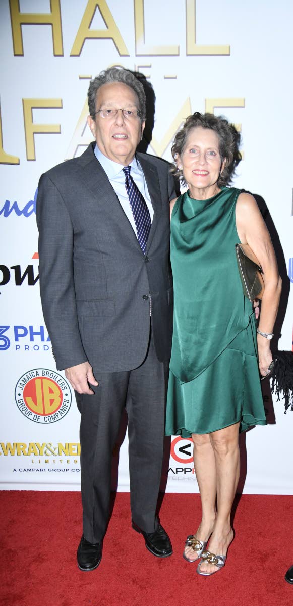 Executive Chairman of the RJRGLEANER Communications Group Joseph Matalon walks the red carpet with his wife, Tracy.