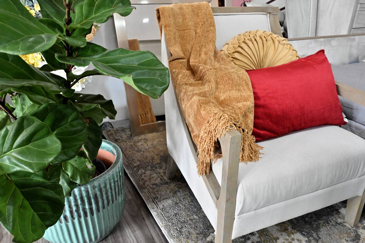 Seasonal throws and cushions in rich reds and golds and other classic holiday tones bring colour, comfort and personality to everyday living spaces.