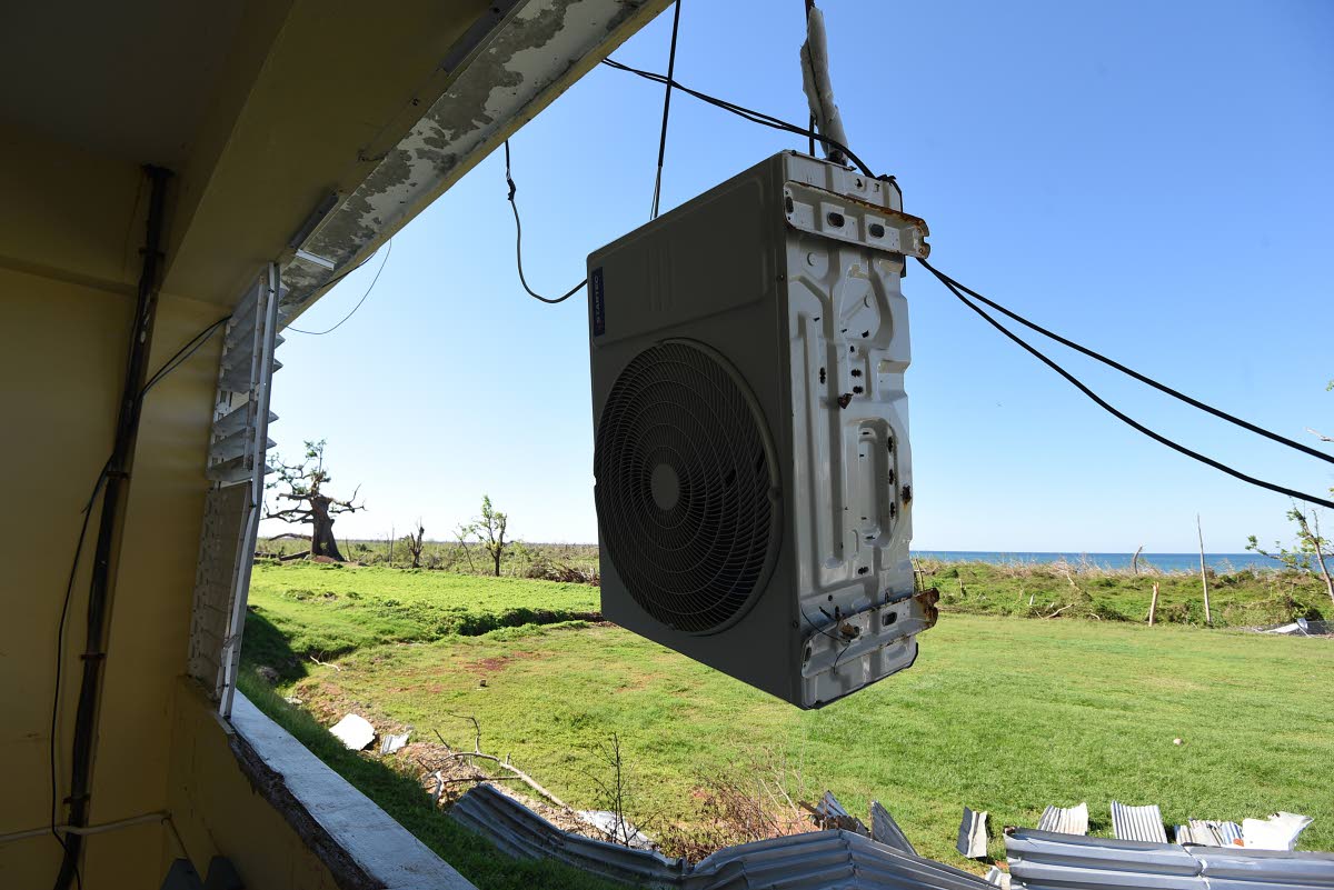 
A dislodged air-conditioning unit dangled outside a classroom at the Belmont Academy in Westmoreland.