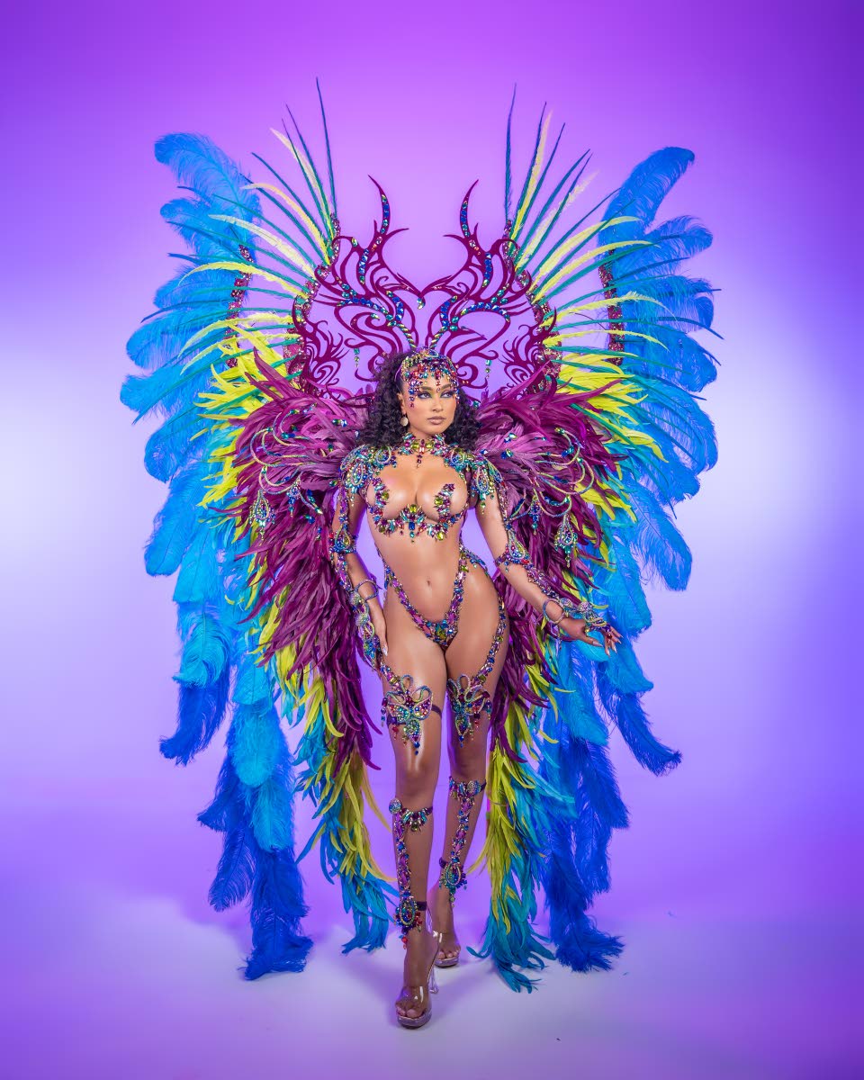 Centre: Designed by Shawn Dhanraj and inspired by the elements and the celestial phenomenon of the Northern Lights, Aurora is defined by radiant colour, expansive feather work and fluid movement. 