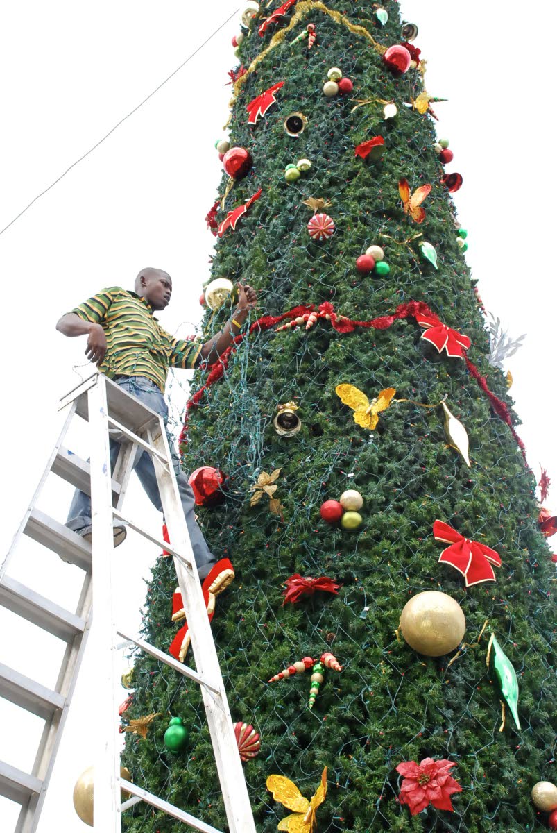 Vermon Taylor is pictured decorating the Christmas tree for the parish of St James.