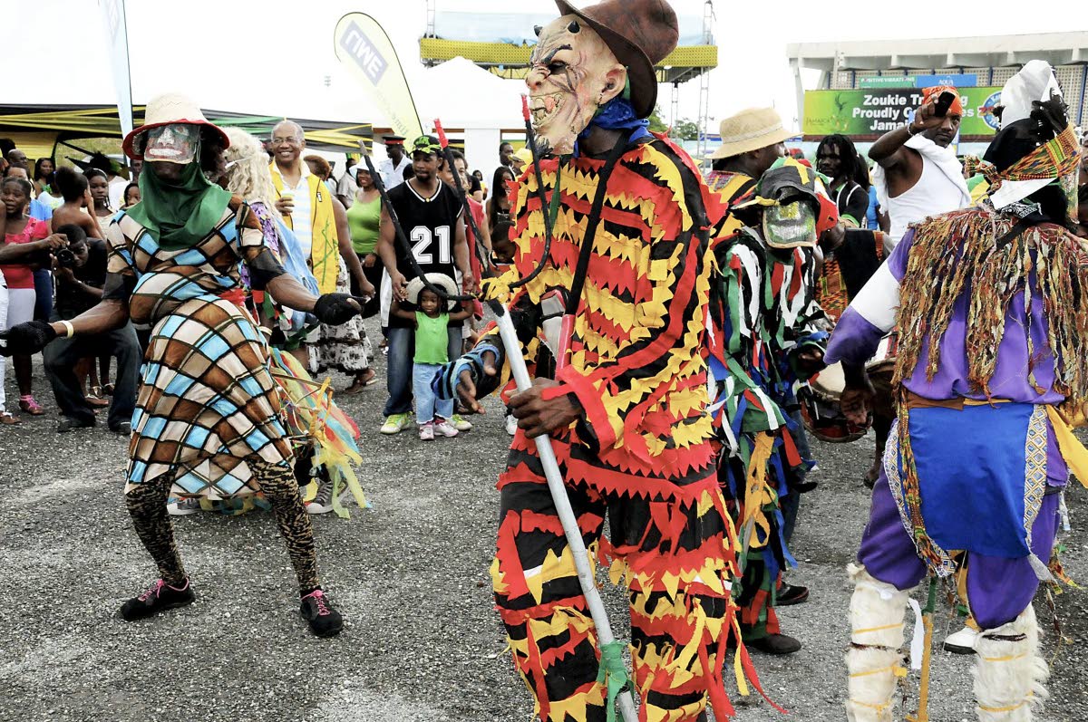 Jonkonnu masqueraders in action
