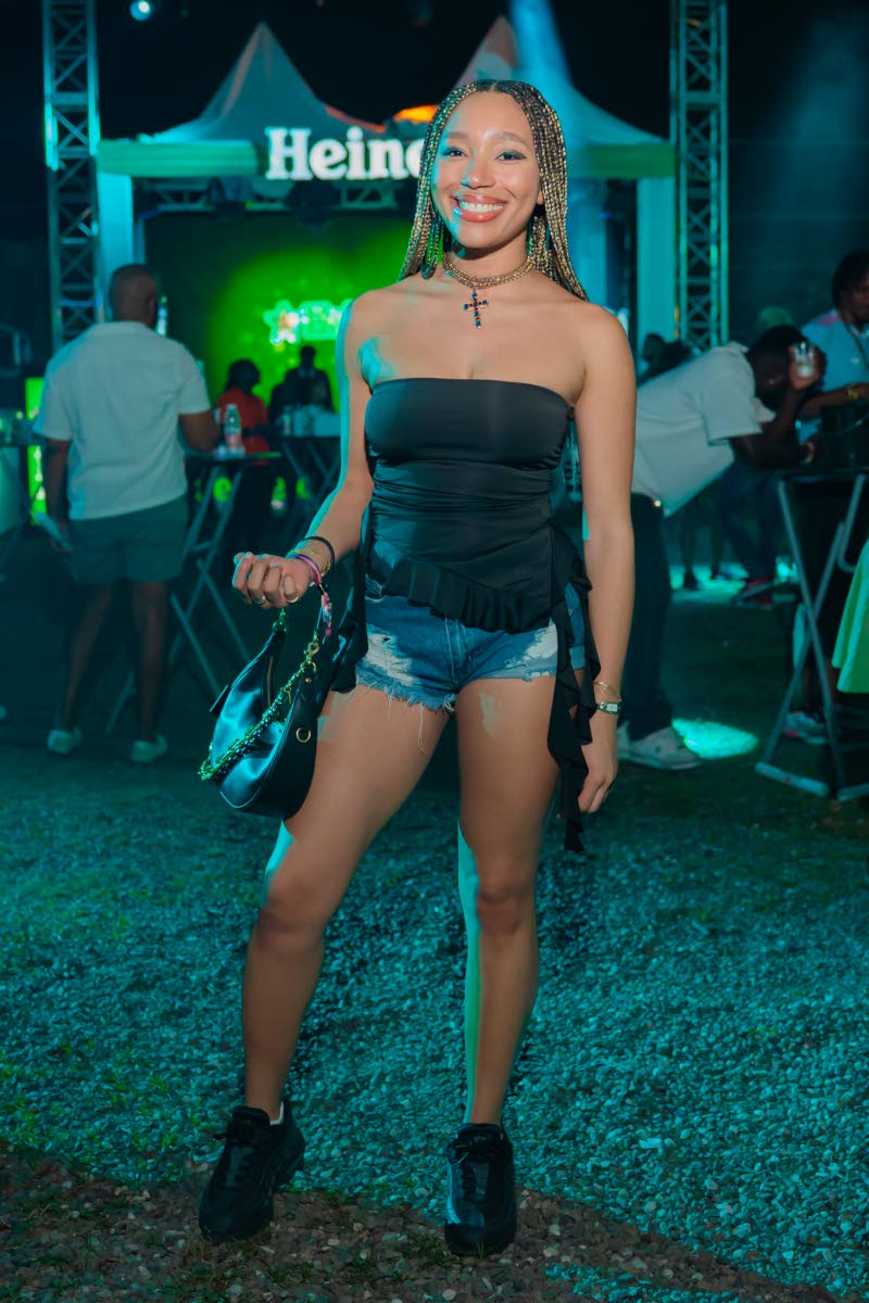 Shelby Barnaby keeps comfortable in a tube top, denim and low tops.