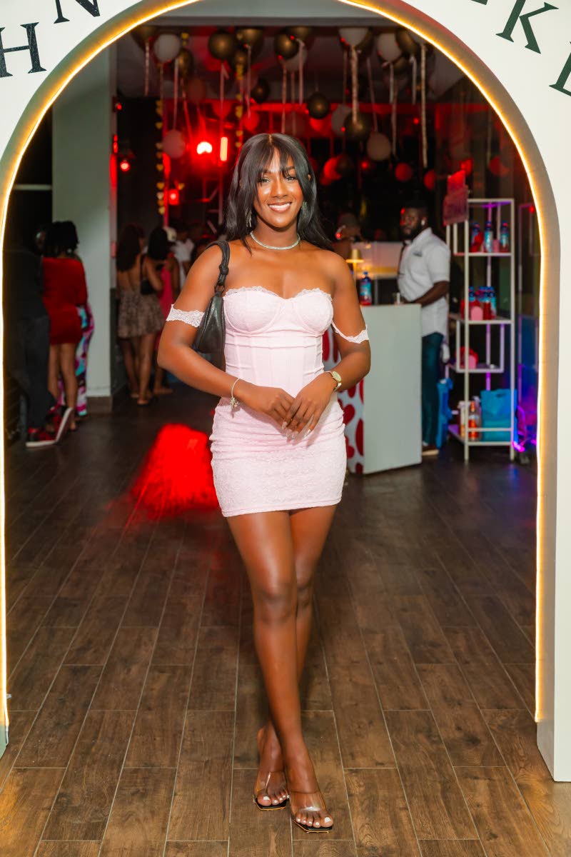 Nisa Wynter makes a confident entrance at Love Languages in her Outcast off-the-shoulder blush mini dress, paired with clear heels and a black shoulder bag.