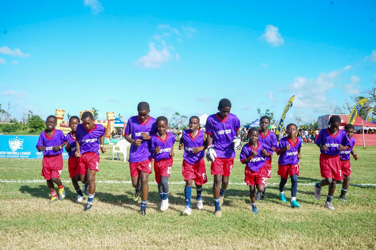Boys prepare for a Youth Football League tournament, one of the highlights of an event organised and hosted by FYI Consultancy Group, in collaboration with the JN Foundation, for residents of Trelawny on the football pitch of the William Knibb Memorial Hig