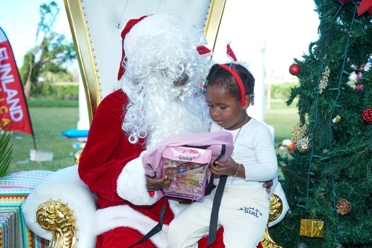 Santa was in town to treat the children of Trelawny who reciprocated their affection through picture moments with the famous Christmas character. They were attending an event organised and hosted by FYI Consultancy Group, in collaboration with the JN Found