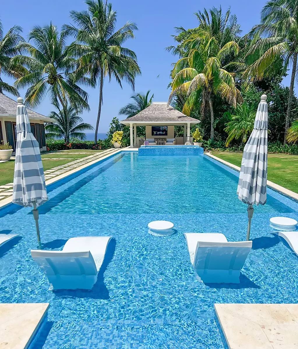 A 50-foot lap pool, with its 12-foot sun shelf. One of two swimming pools.