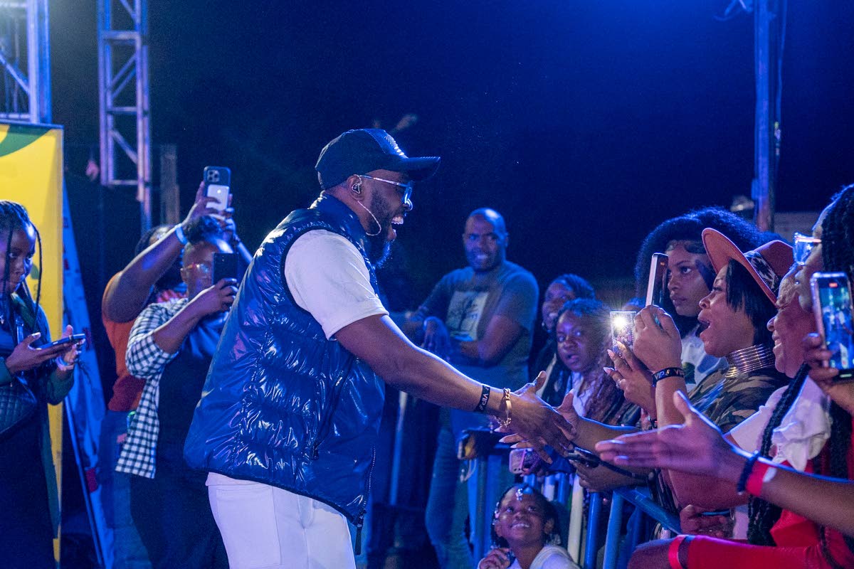 Kevin Downswell greets patrons at Genesis Praise Fest on New Year’s Day in St Andrew, before stepping on stage to close the show.