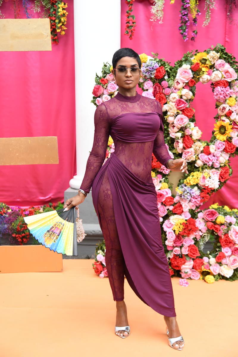 left: Personal Coach Megan McNaughton wears a sleek Fashion Nova look that blends structure with fluidity. The fitted silhouette and deep plum shade create a strong, confident presence, while the soft draping and sheer detailing add elegance and movement.