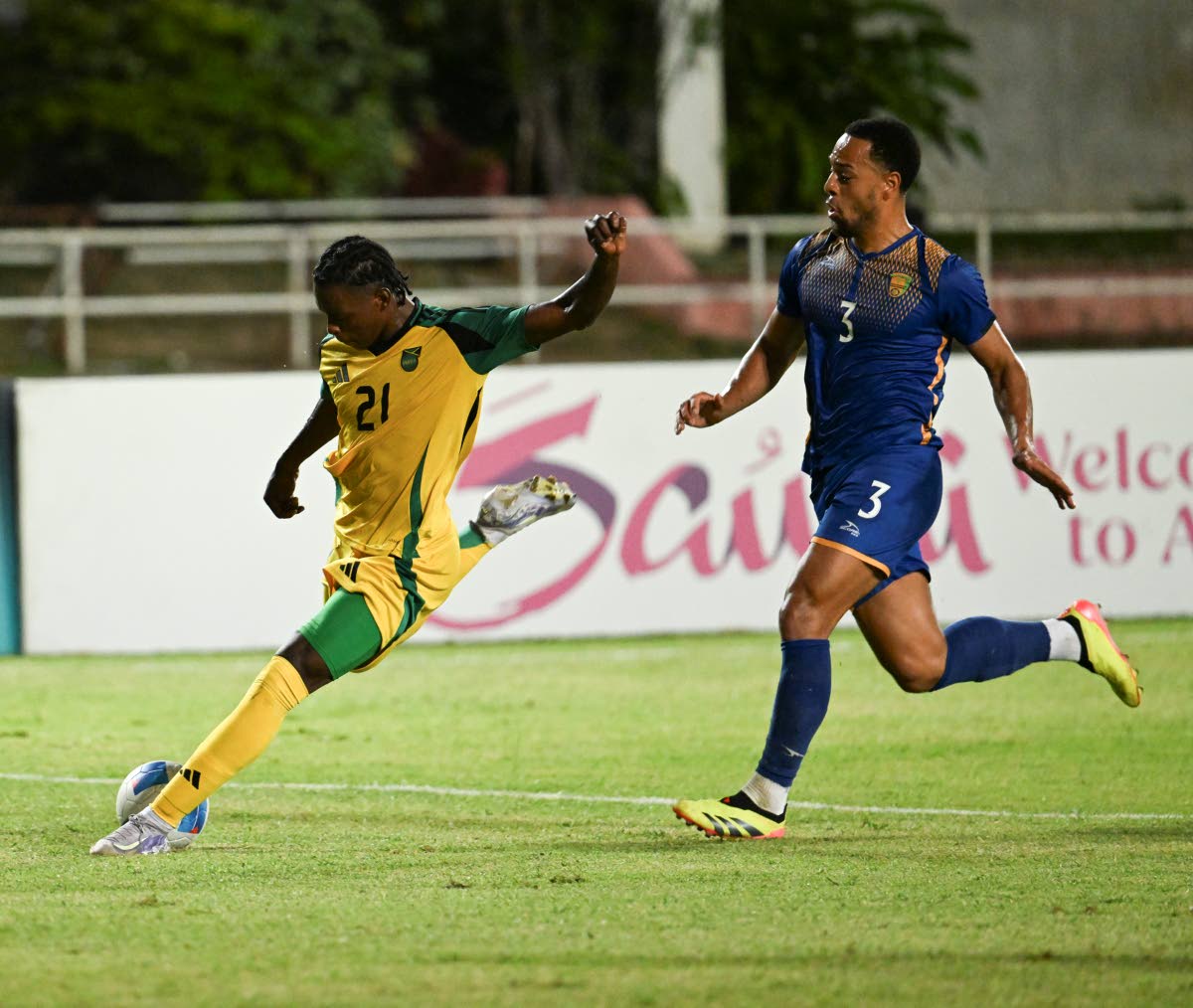 Jamaica’s Warner Brown (left) shoots to score against St Vincent and the Grenadines during the second leg of their Concacaf Gold Cup qualification tie at Sabina Park on Tuesday, March 25, 2025