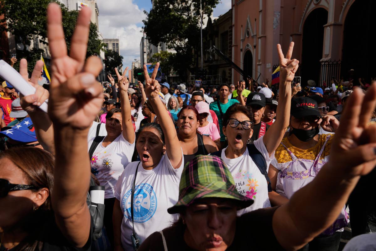 Government supporters demand President Nicolas Maduro’s release from United States custody during a protest in Caracas, Venezuela, yesterday.