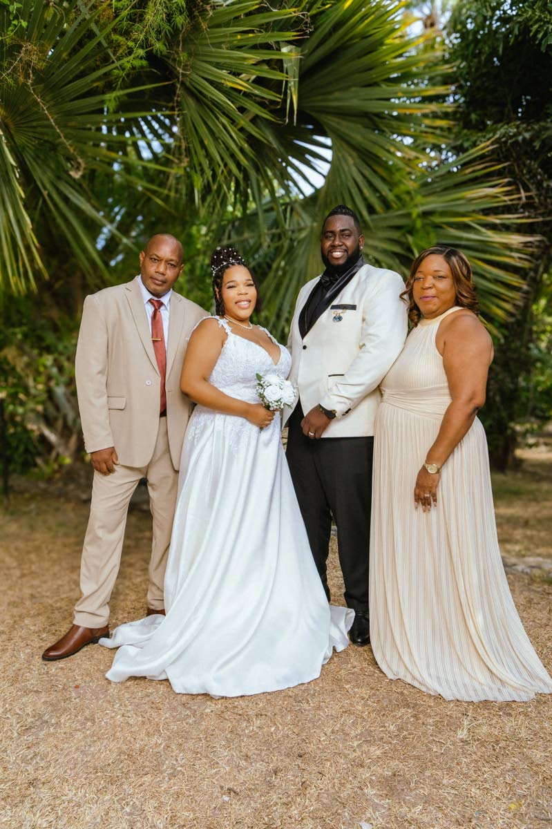 The Henrys were happy to have the support of Danae’s father, Peter Watson (left), and her mother, Netollia Fairweather-Sims.
