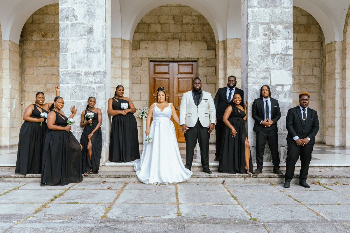 Standing firmly in love, Stefon and Danae are flanked by their bridal party on their wedding day. From left: Renee Davis, Gabrielle Stewart, Nzingha Watson, Kendra Donaldson-Henry, Travis Williams, Chloe Piper, Philliphe Dobson and Paul Henry.