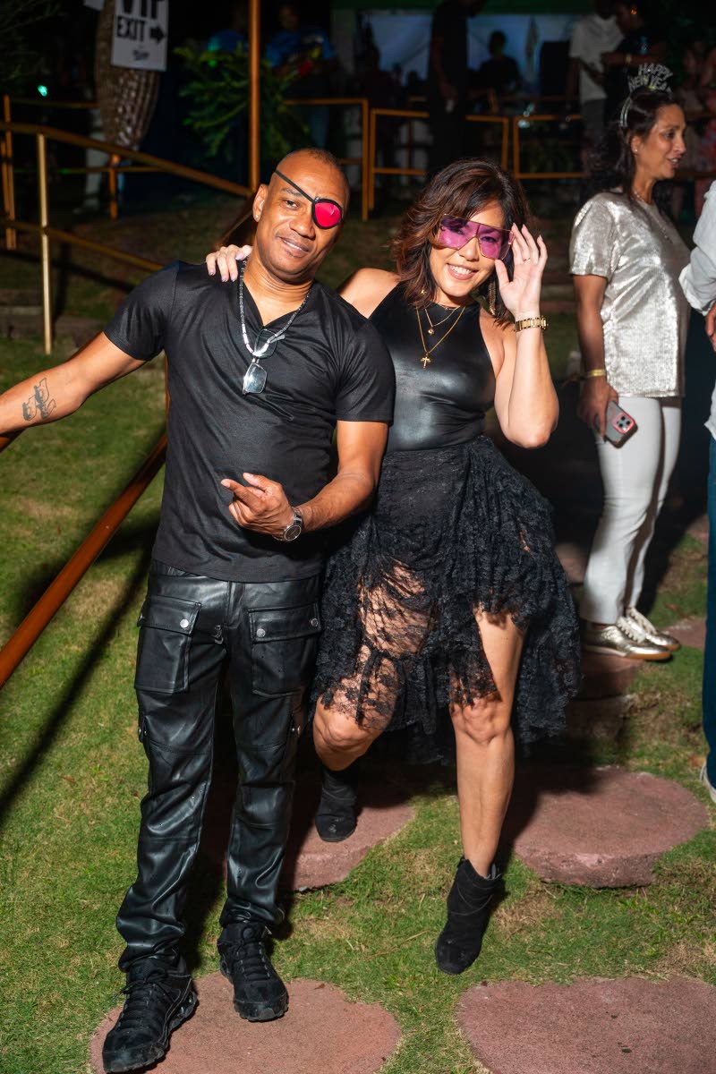 Renaissance Sound CEO DJ Delano (left) and his girlfriend, entrepreneur Juanita Diaz, are matched for the moment in all-black. 