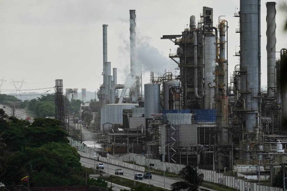 Vehicles drive past the El Palito refinery in Puerto Cabello, Venezuela, Sunday, December 2025. (AP Photo)