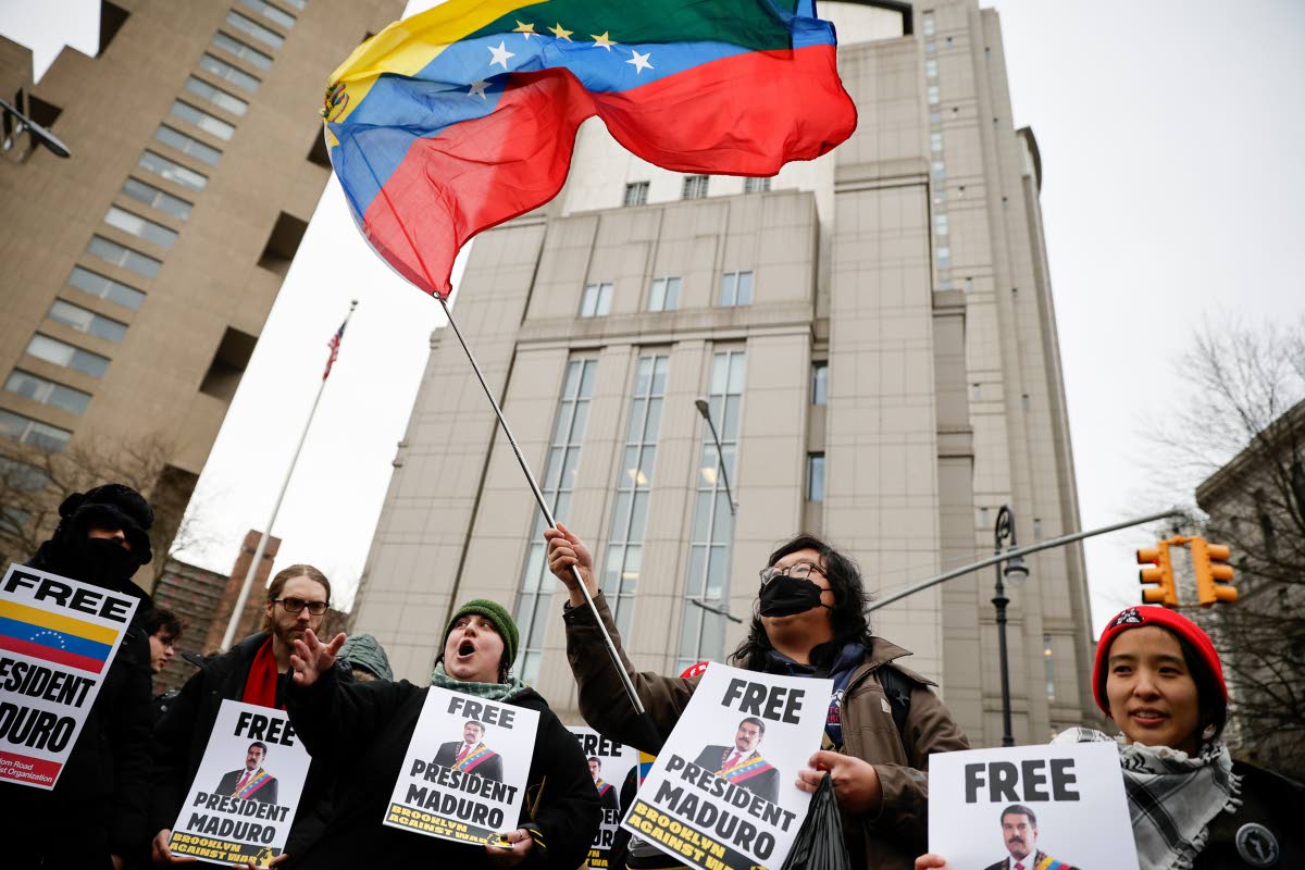 Protesters hold signs calling for the release of Venezuelan President Nicolas Maduro outside Manhattan Federal Court before his arraignment in New York on Monday, January 5.