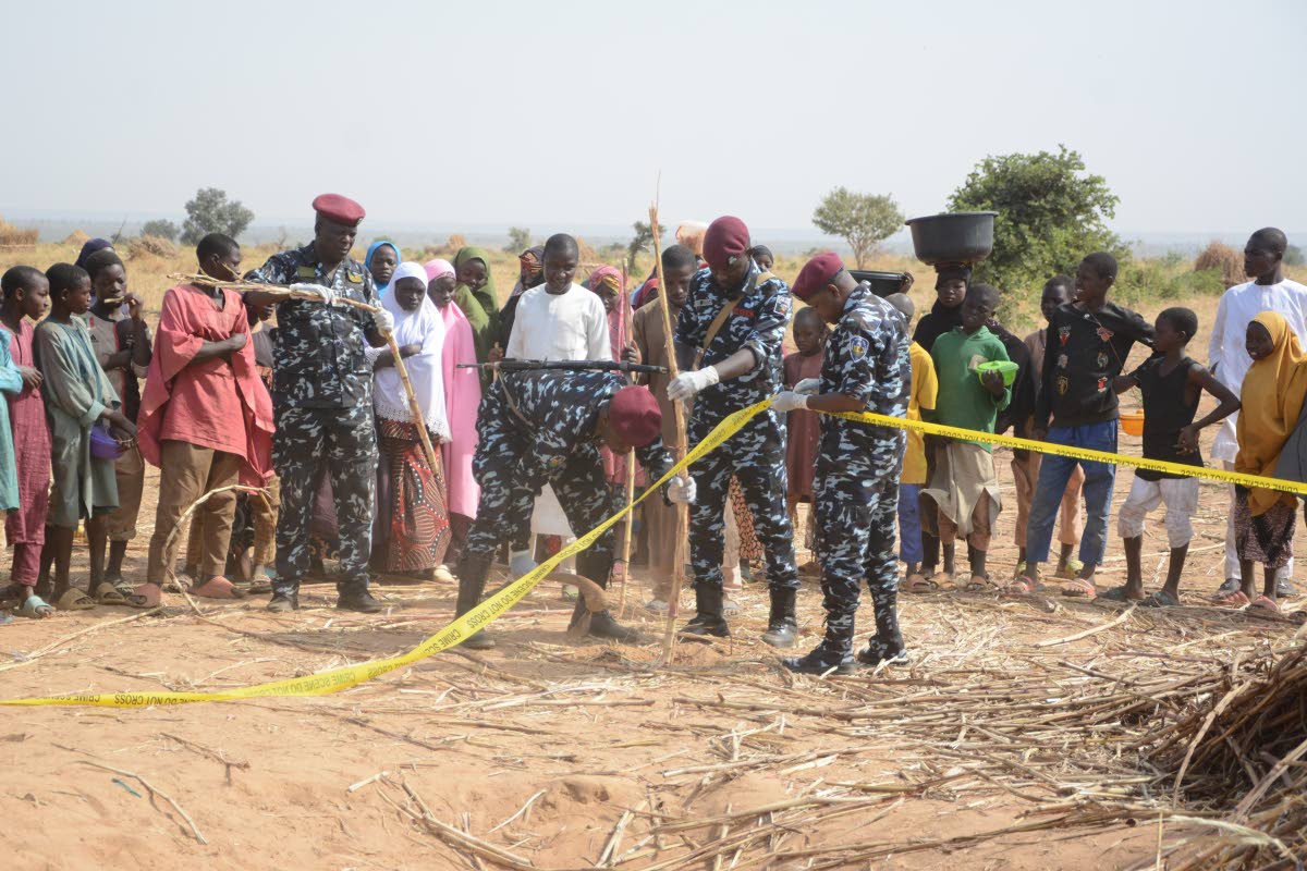 Nigeria police, Anti-Bomb squad, secure the scene of a US airstrike in Northwest, Jabo, Nigeria, Friday, December 26, 2025. 
