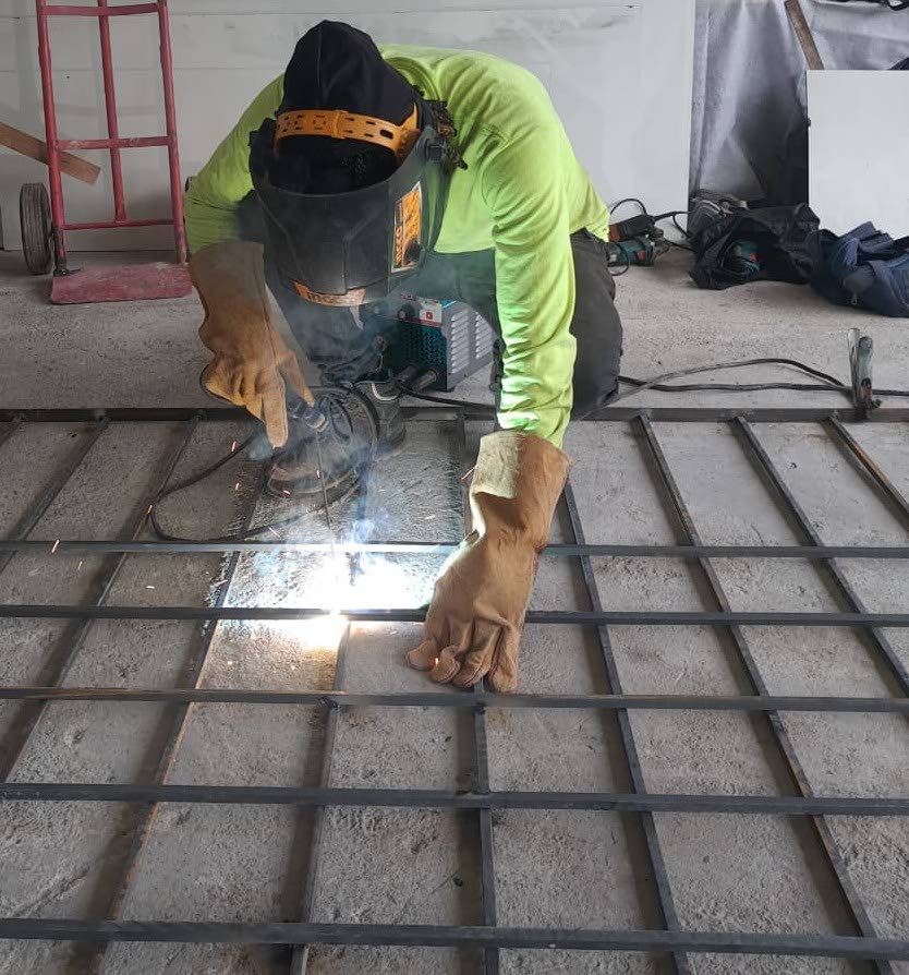 Nicarlo Lewis at work welding from his Comfort Hall workshop.