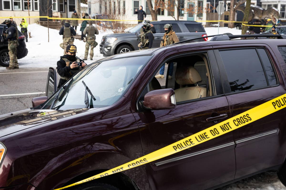 A bullet hole and blood stains are seen in a crashed vehicle at the scene of a shooting in Minneapolis in the United States yesterday. 